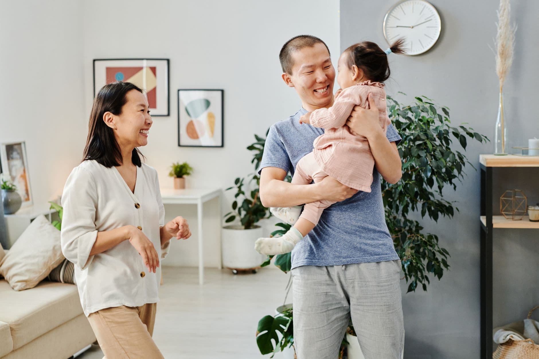 Smiling family spending joyful moments together indoors with natural light.
