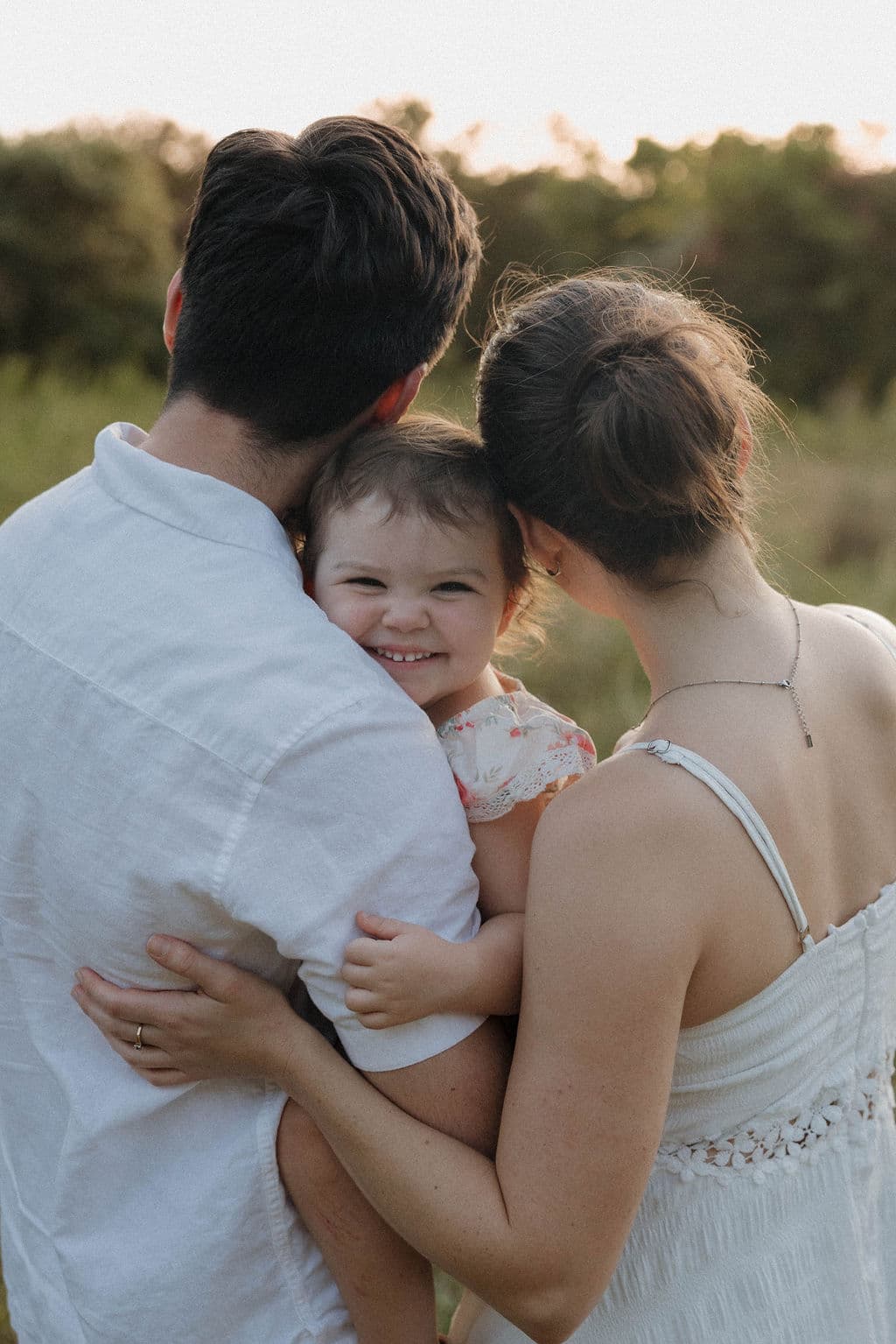 Caleb Dupae and his wife holding their daughter